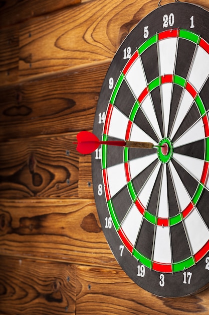 The darts on wooden wall