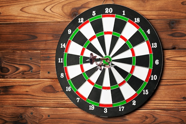 The darts on wooden wall