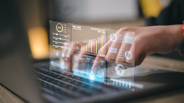 Data analyst working on business analytics dashboard with charts metrics and KPI to analyze performance and create insight reports for operations management