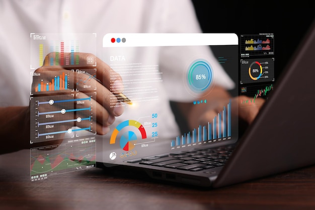 Photo data analyst working on business analytics dashboard with charts with kpi and metrics connected to the database for technology finance operations sales marketing