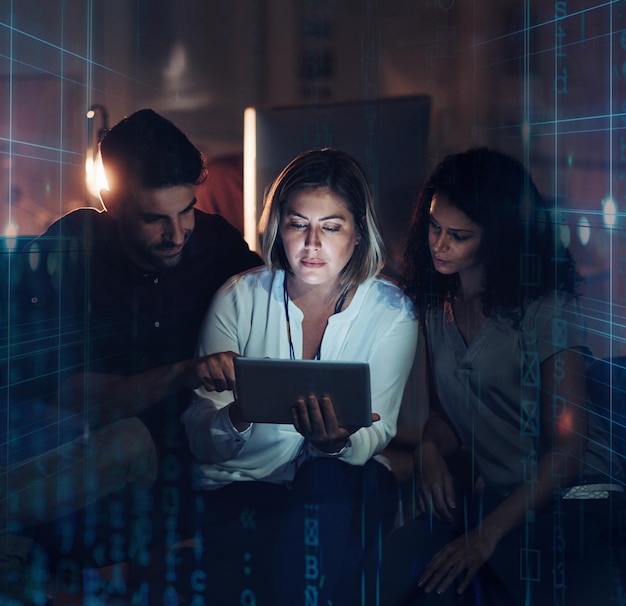 data hologram future overlay and tablet at night with statistics and it team planning coding hologram analytics and information technology with employee group working on ux and iot collaboration