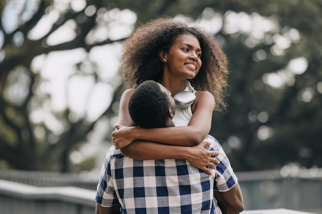 Photo date couple man and women valentine day african black lover at park outdoors summer season