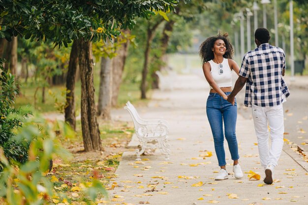 Photo date couple man and women valentine day african black lover at park outdoors summer season