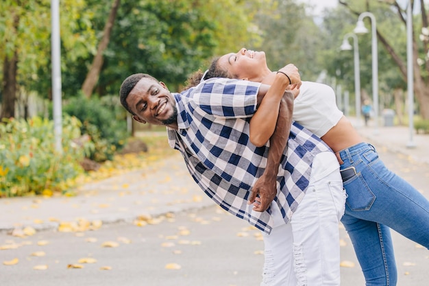 Photo date couple man and women valentine day african black lover at park outdoors summer season