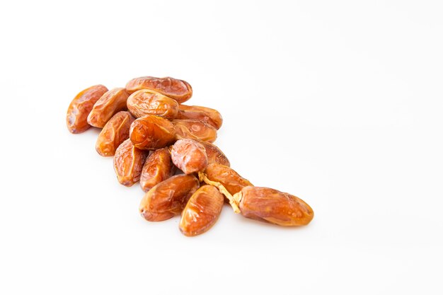 Date fruits over white background