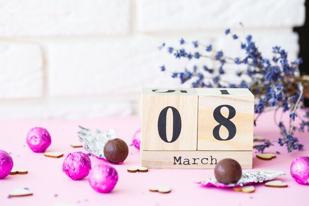 Date of March 8, International Women's Day with copy space. Wooden decorative calendar