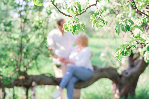 A date of two adults in the park unrecognizable persons Selective focus