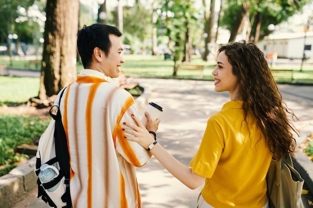 dates chatting during stroll in park