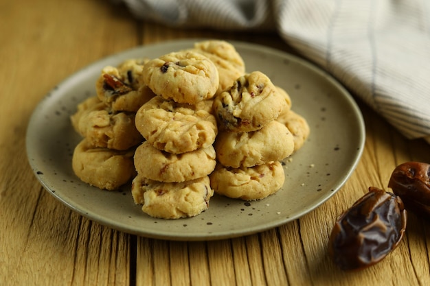 Dates cookies is a kind of butter cookies with dates fruits and grated almonds