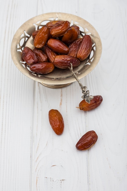 Dates fruit on small plate on table