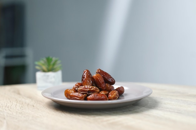 Dates Fruit on Wooden Table with Light Beam for Aesthetic Ramadan Background