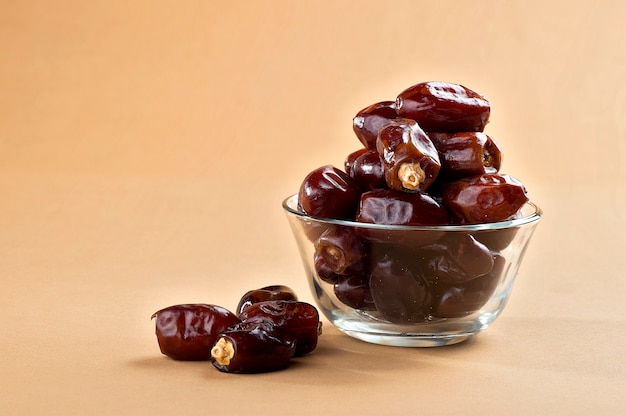 Dates in glass bowl. Dries dates fruit