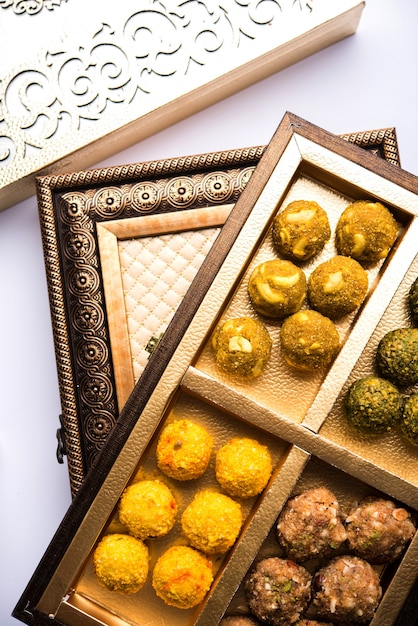 Dates oatmeal balls Or Dry Fruit Laddu in a plate of Gift box packing, selective focus