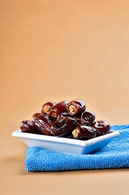 Dates in plate. Dried dates fruits.