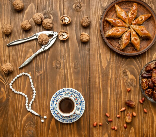 Dates, rosaries and baklava. Ramadan. Selective focus.