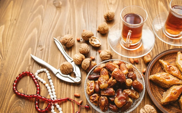 Dates, rosaries and baklava. Ramadan. Selective focus.