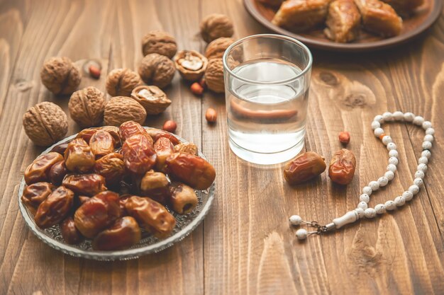 Dates, rosaries and baklava. Ramadan. Selective focus.