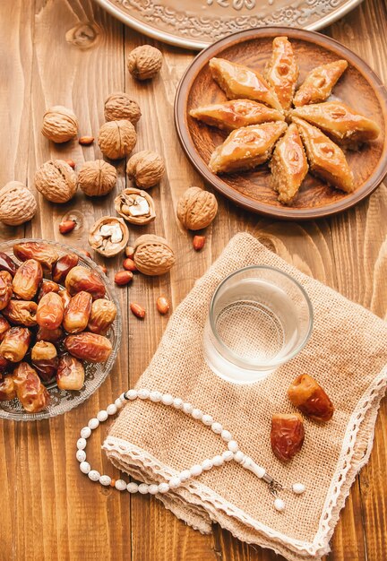 Dates, rosaries and baklava. Ramadan. Selective focus.