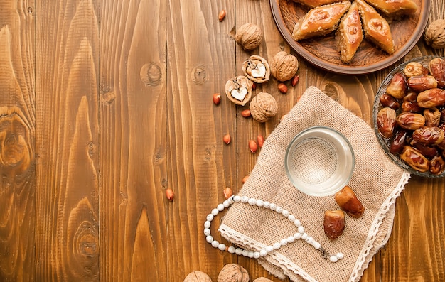 Dates, rosaries and baklava. Ramadan. Selective focus.