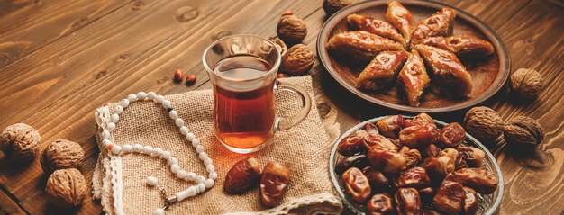 Dates, rosaries and baklava. Ramadan. Selective focus.