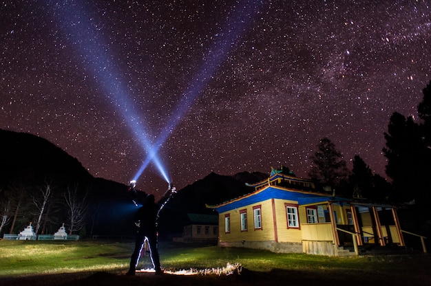 Datsan and mountain with star in night time.