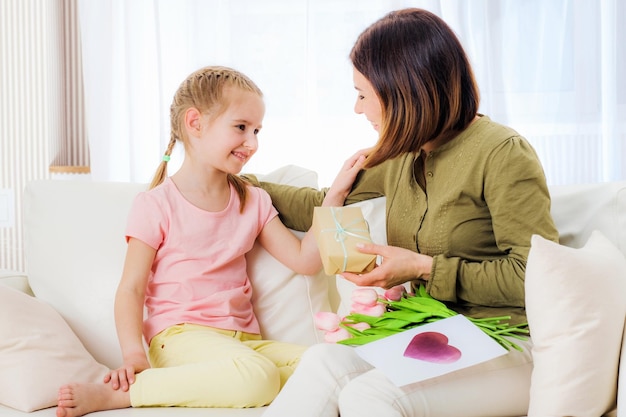 Daughter giving mother presents