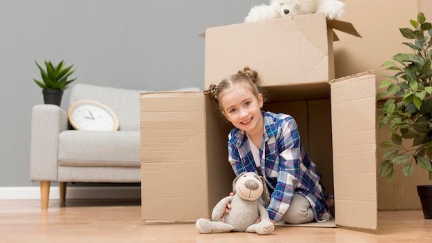 Daughter helping packing the boxes