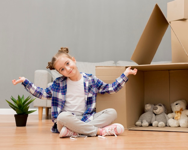 Daughter helping packing the boxes