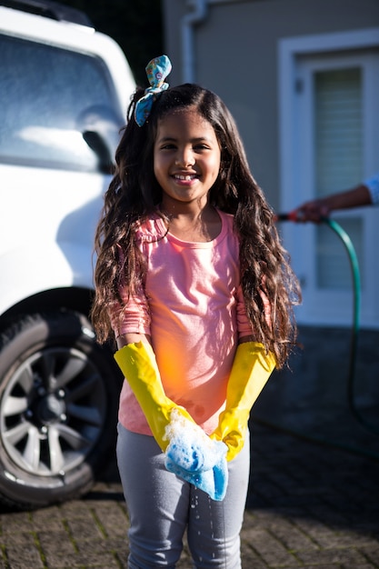 Daughter holding sponge