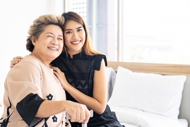 Daughter hug elderly mother