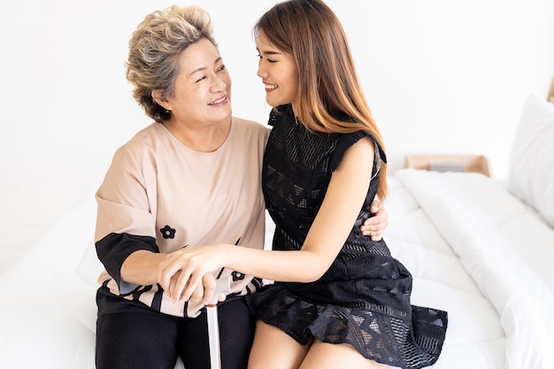 Daughter hug elderly mother