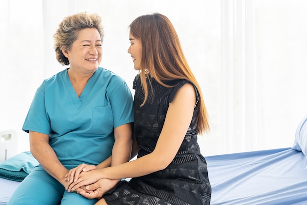 Daughter hug elderly mother