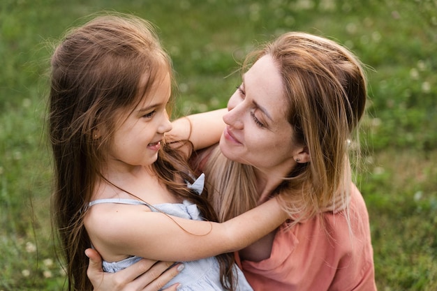 Daughter hug her mom Hapiness emotion Family values Happy family lifestyle Happiness and joy of mom hugging her child