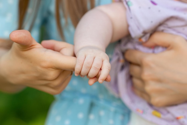 The daughter took her mother by the finger with her little pen