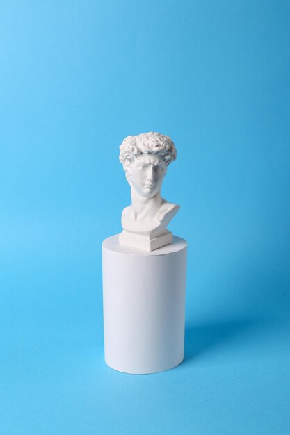 사진 david bust on podium blue background conceptual pop minimal still life photography