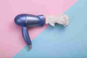 Photo david bust with hair dryer on pink blue background creative layout minimal still life flat lay top view