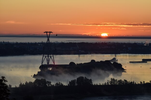 dawn over the cable car across the river