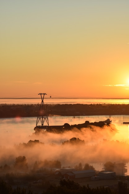 dawn over the cable car across the river