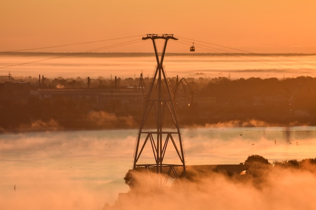 dawn over the cable car across the river