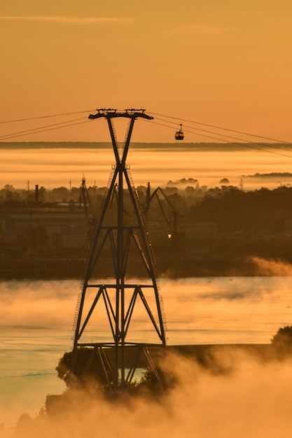 dawn over the cable car across the river