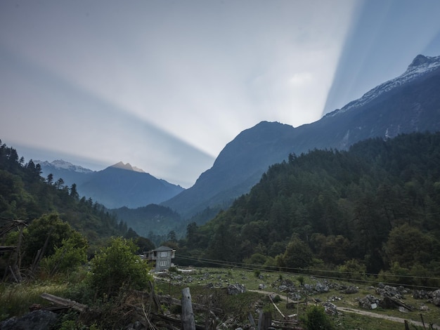 Dawn rays from behind the Himalayan mountains