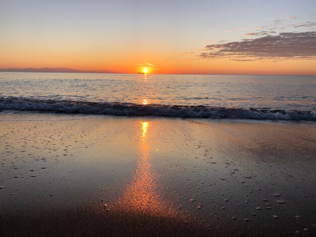 Dawn at sea sand beach Rhodes Greece