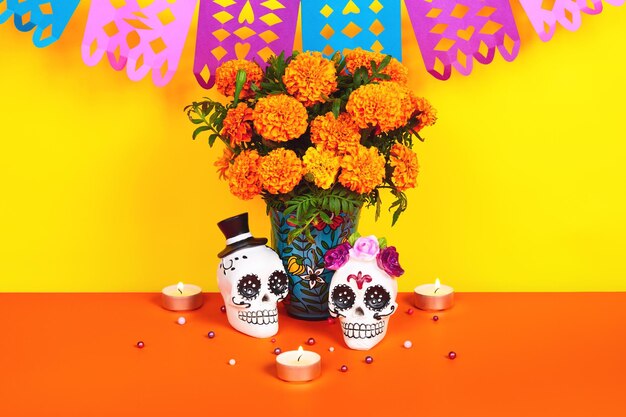 The day of dead tradition celebrate with food meal mask skull face makeup flowers marigold decorate