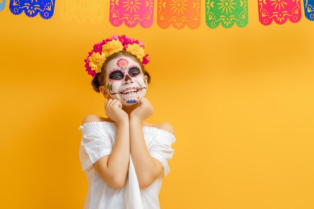 The day of dead tradition celebrate with food meal mask skull face makeup flowers marigold decorate