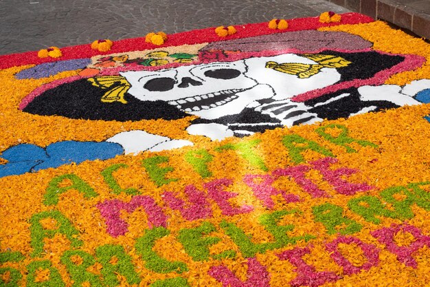 The day of dead tradition celebrate with food meal mask skull face makeup flowers marigold decorate