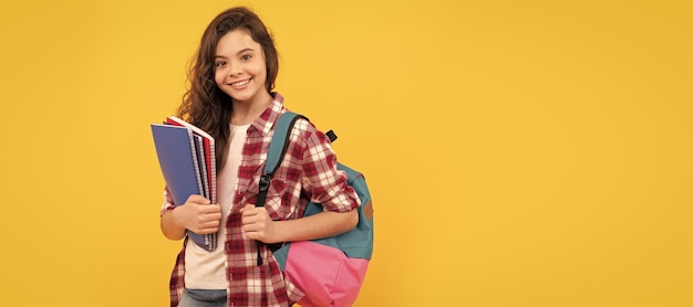 Day in high school schoolgirl with notebook and backpack back\
to school teen girl ready to study banner of school girl student\
schoolgirl pupil portrait with copy space