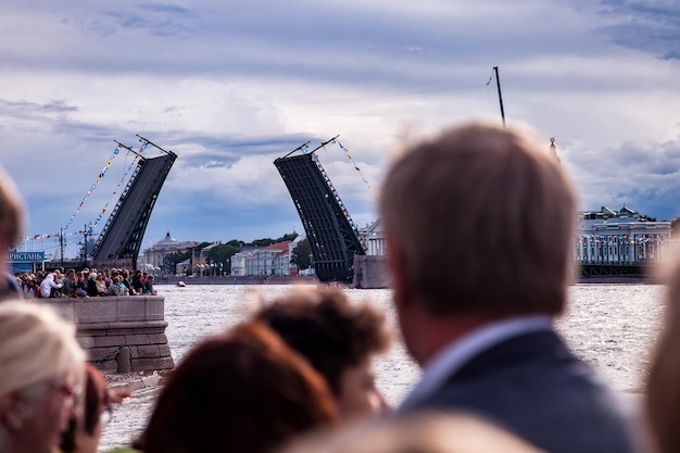 Day of Navy of Russia naval parade People on embankment Neva river