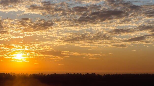 Day's Unveiling Sun Peeks Above the Horizon