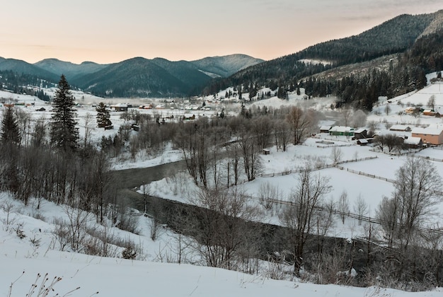 Daybreak winter Carpathian mountain village Zelene Verkhovyna Ukraine