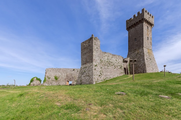 Daylight on Rocca of Radicofani fortress with plants on brick walls Tuscany Italy